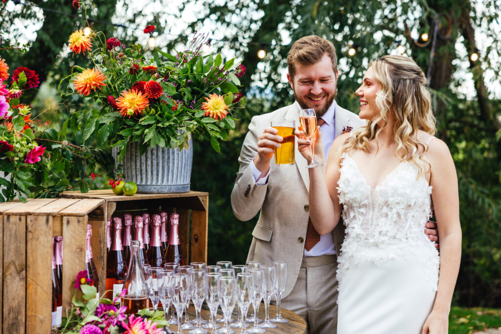 Bride and groom enjoying local alcoholic beverages from their welcome drink station