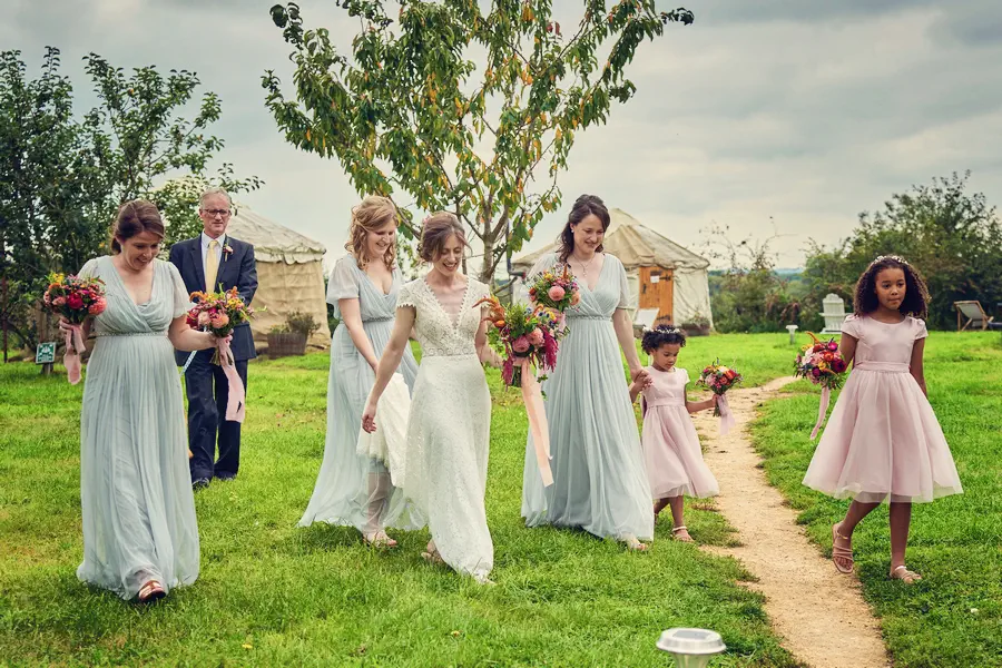 West Midlands wedding venue, bride and her bridal party walking in the grounds